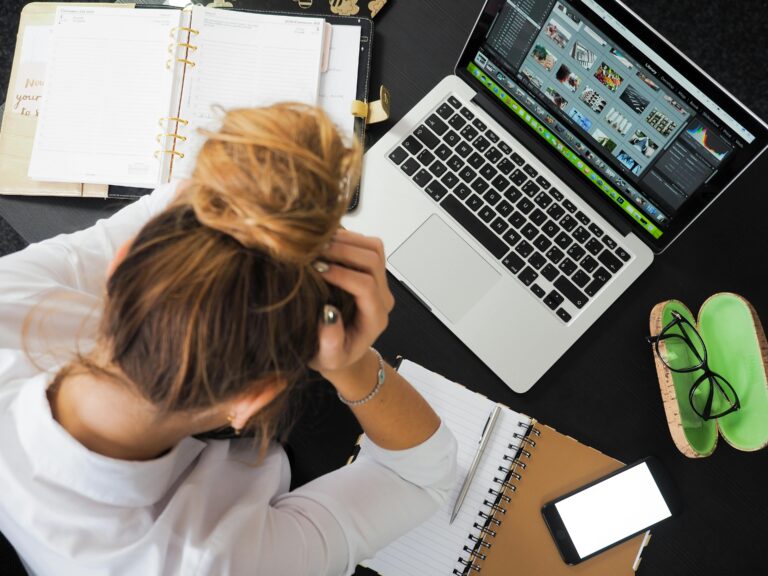 Stressed Business Owner Looking At Laptop, Before Joining Our Services